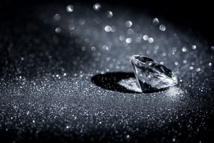 A beautiful diamond sparkling in the black background.