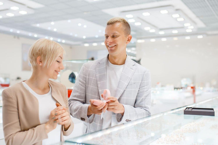 A guy buying an expensive engagement ring for his girlfriend