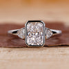 Radiant cut engagement ring with white gold ring.
