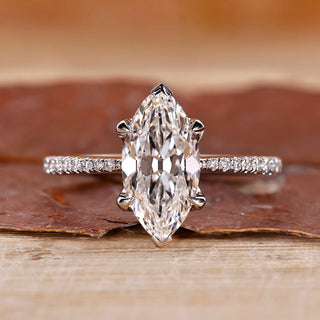 Marquise diamond ring crafted in white gold with a handmade finish.
