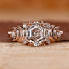 vintage engagement ring with round diamond side stone.
