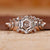 vintage engagement ring with round diamond side stone.
