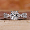 cushion cut engagement ring with twisted pave engagement ring.

