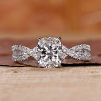cushion cut engagement ring with twisted pave engagement ring.
