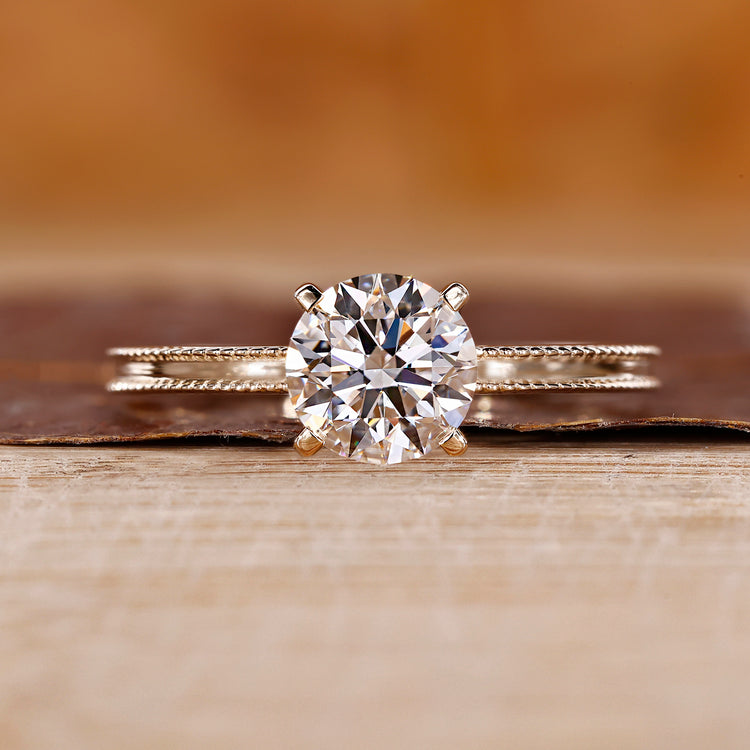 Yellow gold engagement ring with round cut diamond ring.
