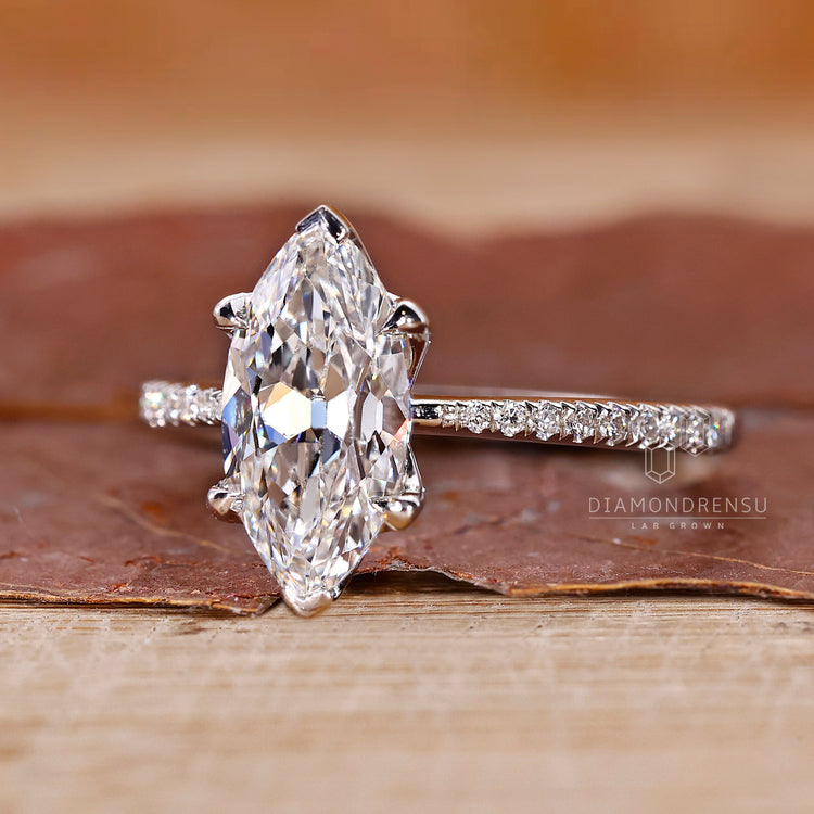 V prong setting diamond ring in white gold with elegant marquise design.

