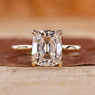 Old mine cushion cut diamond ring with solitaire engagement ring.
