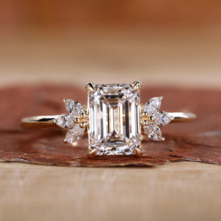 Emerald cut diamond ring with four claw prong setting.
