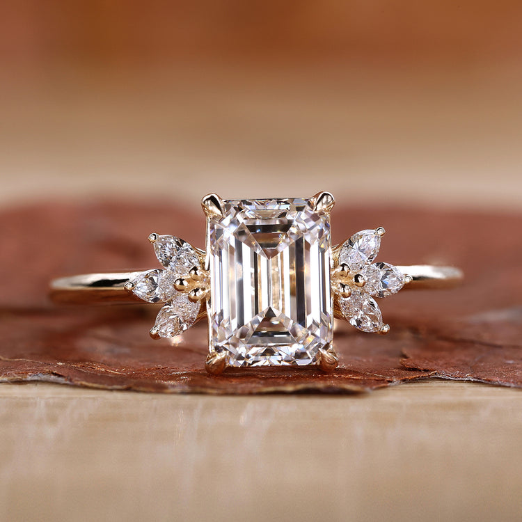 Emerald cut diamond ring with four claw prong setting.
