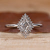 Halo diamond engagement ring with lozenge diamond engagement ring.
