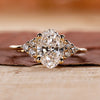 Oval Cut Diamond Engagement Ring with round cut side stones ring.
