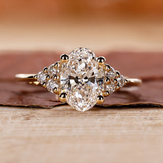Oval Cut Diamond Engagement Ring with round cut side stones ring.

