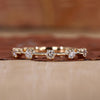 Yellow gold wedding band with round cut diamond band.
