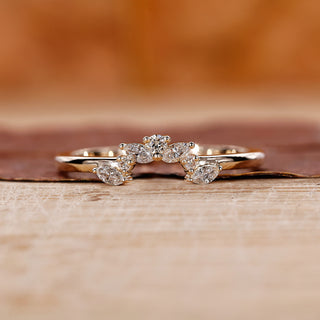 Marquise and round wedding band with tiara wedding band.
