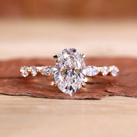 Oval shaped engagement ring with four claw prong setting.
