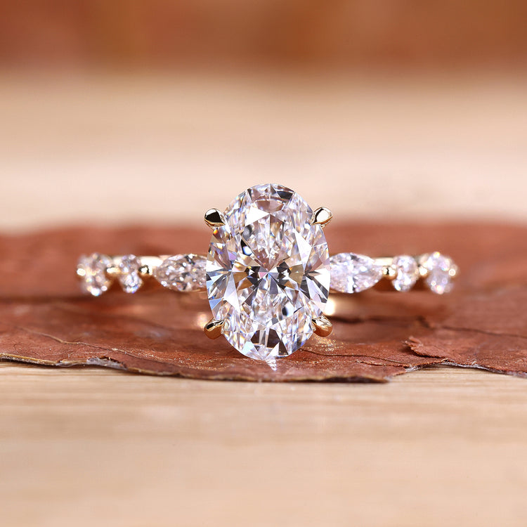 Oval shaped engagement ring with four claw prong setting.
