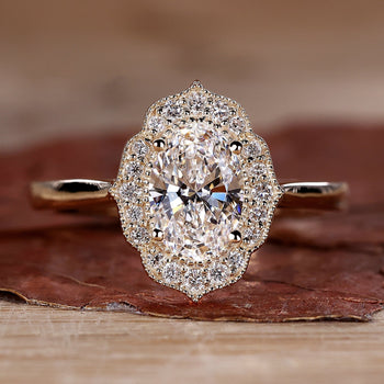Close-up of a sparkling oval halo engagement ring with a polished silver band