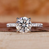 round cut engagement ring with pave ring setting.
