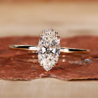 Marquise cut diamond ring in yellow gold.
