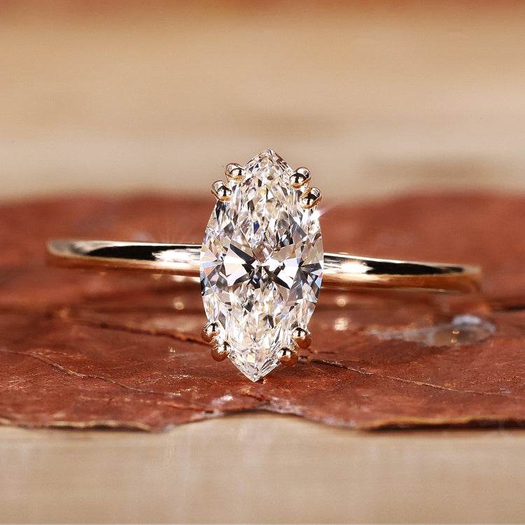 Marquise cut diamond ring in yellow gold.
