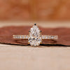 Pear diamond engagement ring with hidden halo setting