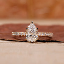Pear diamond engagement ring with hidden halo setting