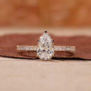 Pear diamond engagement ring with hidden halo setting