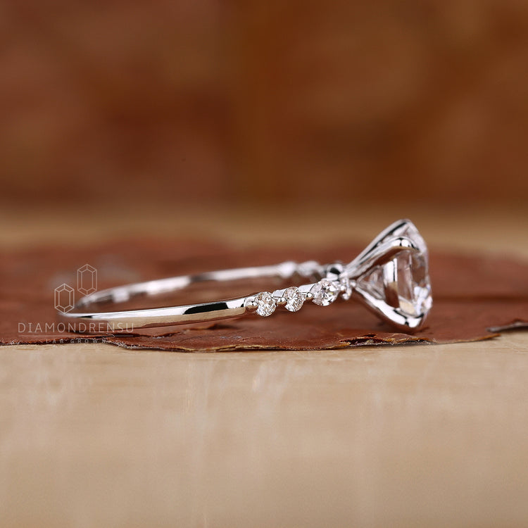 Buy engagement ring with unique marquise and round accents.
