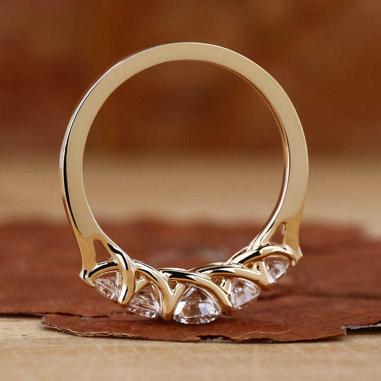 Handmade jewelry shows custom diamond band.
