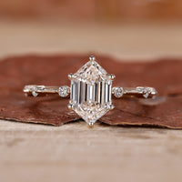 yellow gold engagement ring with distance pave ring.
