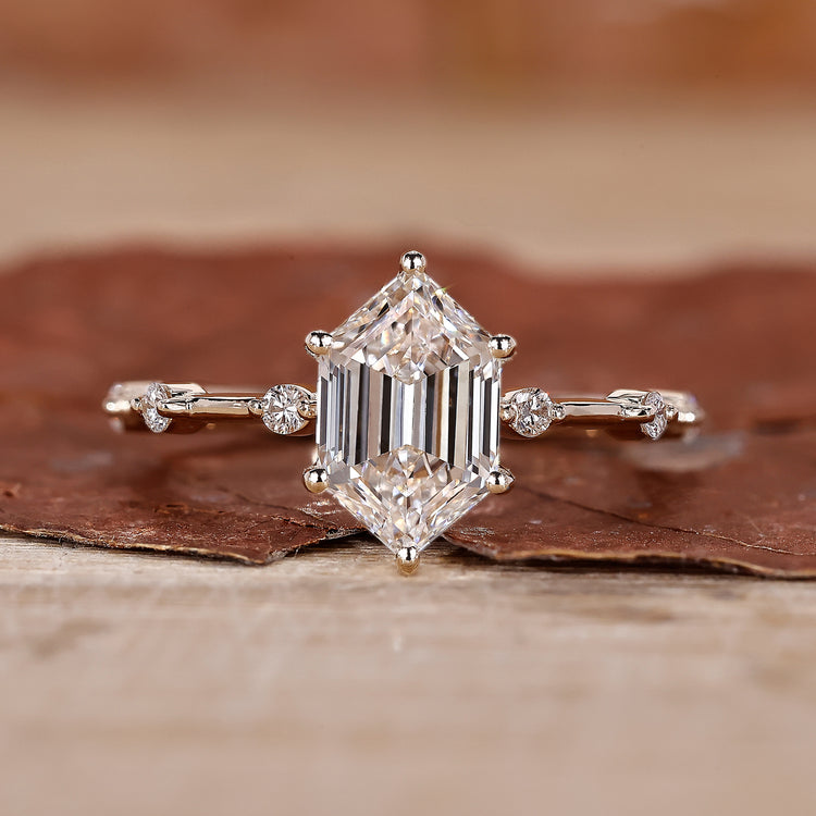 yellow gold engagement ring with distance pave ring.
