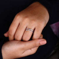 Cluster diamond band with double row pave band.
