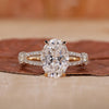 oval diamond engagement ring with split shank band.
