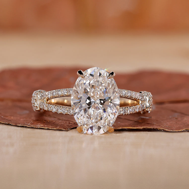 oval diamond engagement ring with split shank band.
