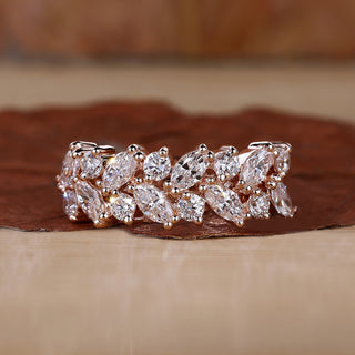Rose gold wedding band with prong setting.
