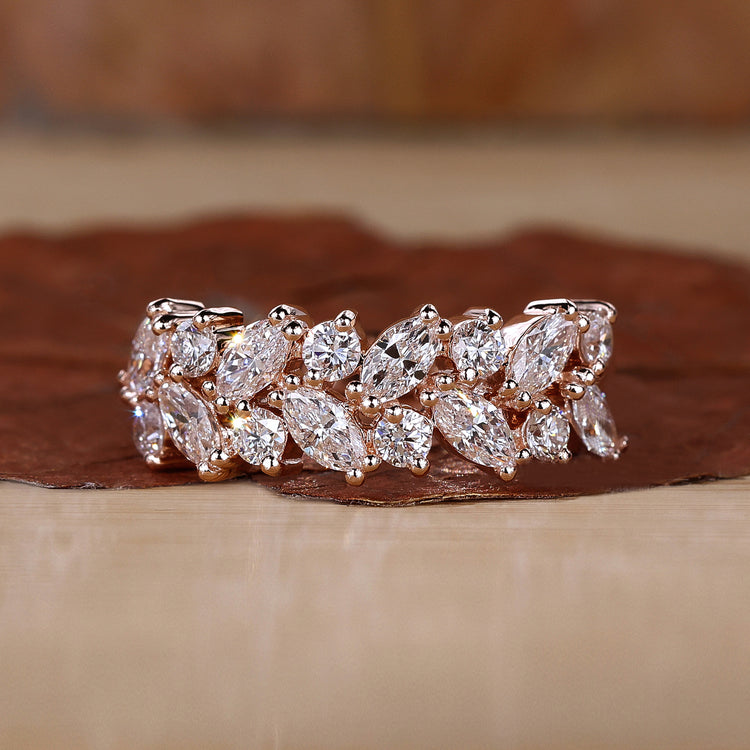 Rose gold wedding band with prong setting.
