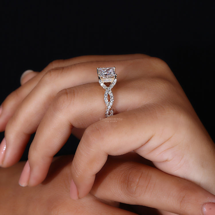 Round cut hidden halo setting in yellow gold engagement ring.
