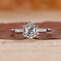 hexagon engagement ring with pave setting ring.

