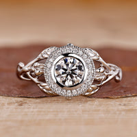Bezel setting ring with round diamond and milgrain details.
