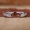 Emerald cut wedding band with prong setting.
