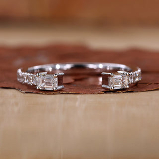 Emerald cut wedding band with prong setting.
