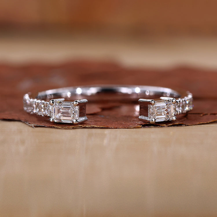 Emerald cut wedding band with prong setting.
