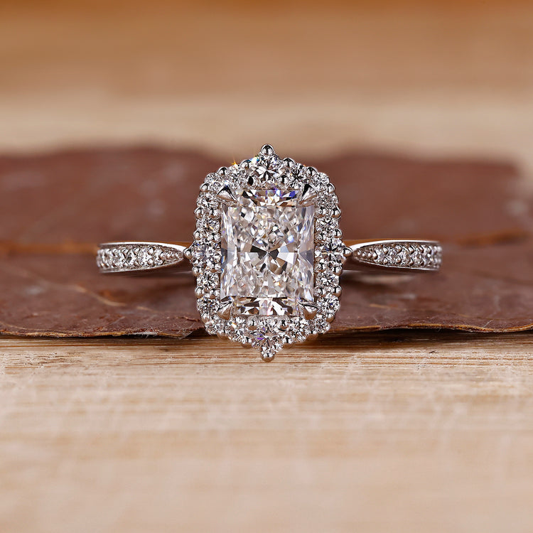 Radiant Engagement Ring with tapered shank and halo setting.
