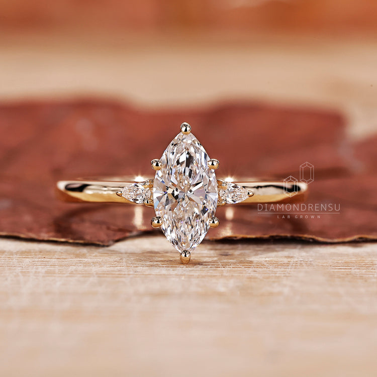 3 Stone Diamond Ring with marquise cut diamond ring.
