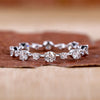 Round diamond wedding band with prong setting band.
