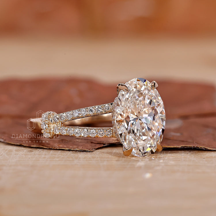 hidden halo engagement ring with oval diamond centre.
