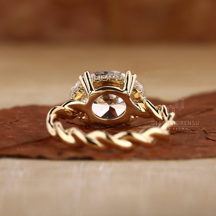 Twisted shank ring with lab grown diamond stones.
