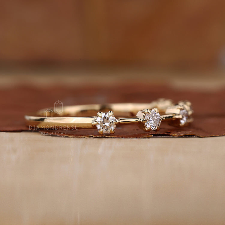 Buy wedding band with claw prong setting.
