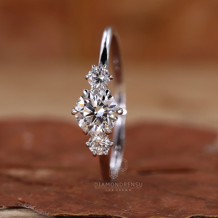 White gold engagement ring with three stone design.
