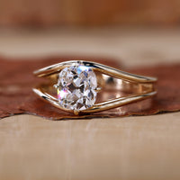 Cushion old mine cut ring with yellow gold diamond ring.
